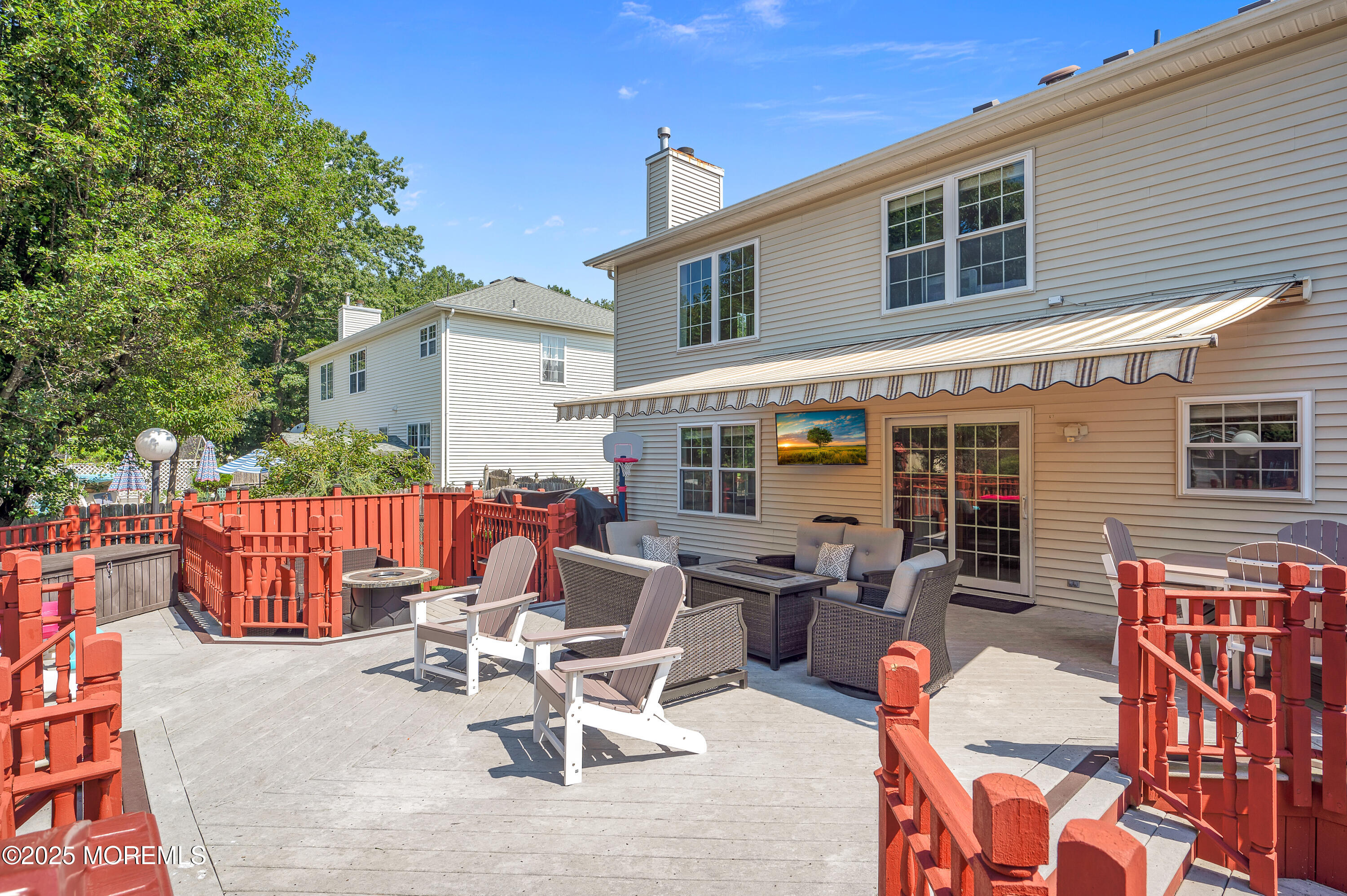 4 Diamond Lane Howell, NJ 07731 - Photo 50 of 63 a view of a patio with a dining table and chairs with wooden floor and fence