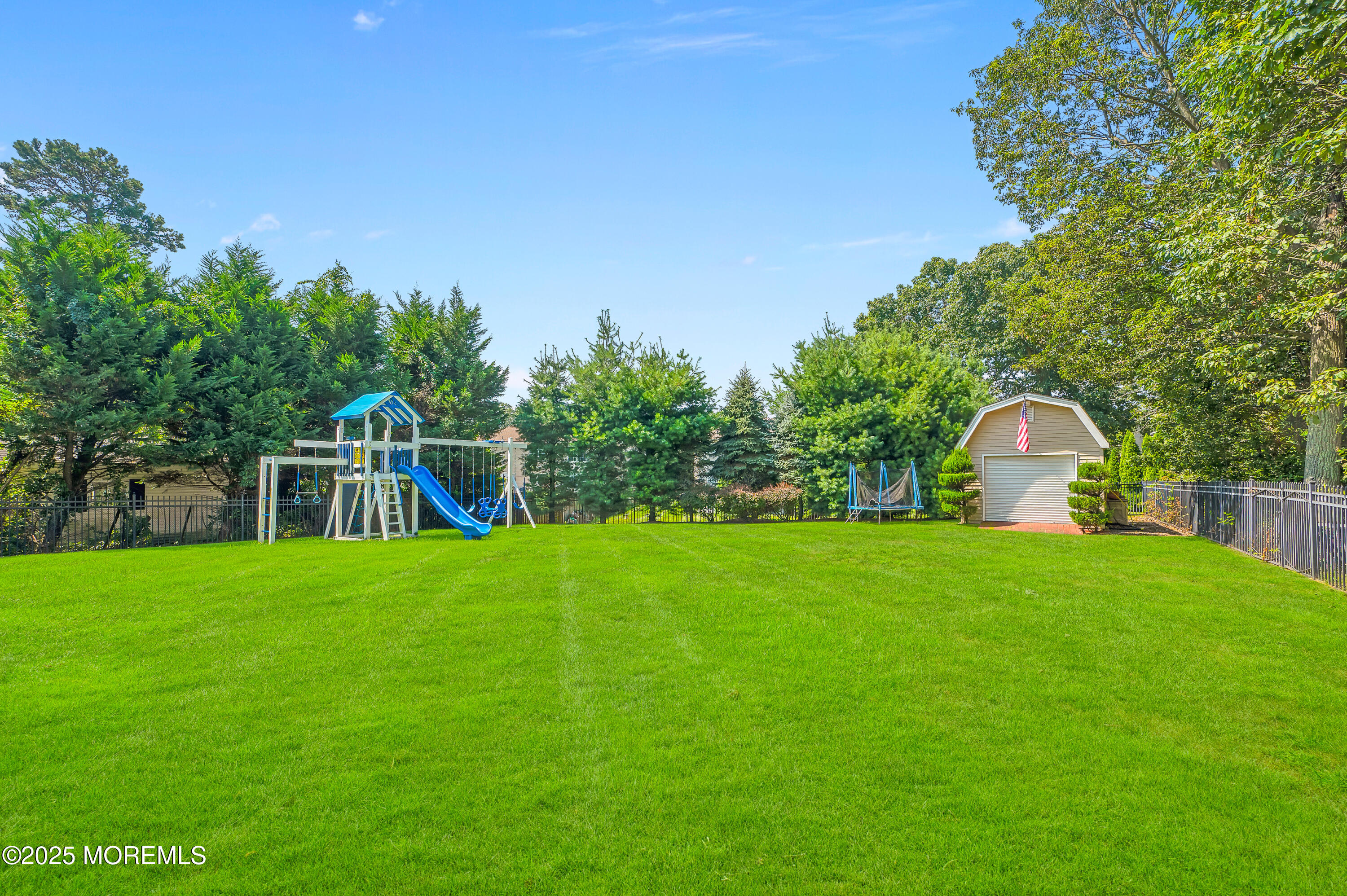 4 Diamond Lane Howell, NJ 07731 - Photo 56 of 63 a front view of a house with a yard and trees