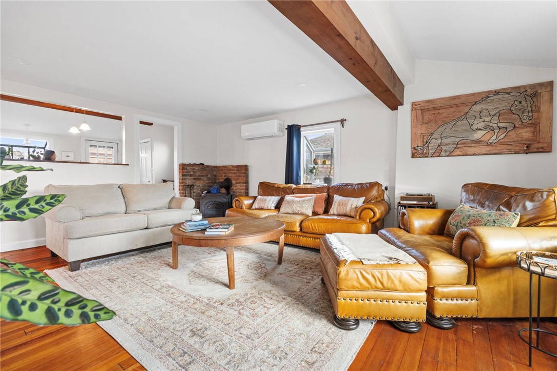 151 Ives Road Warwick, RI 02818 - Photo 12 of 50 The living room flows from the dining room and eat-in kitchen.