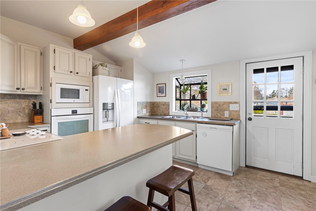 151 Ives Road Warwick, RI 02818 - Photo 16 of 50 The kitchen leads to the back deck.
