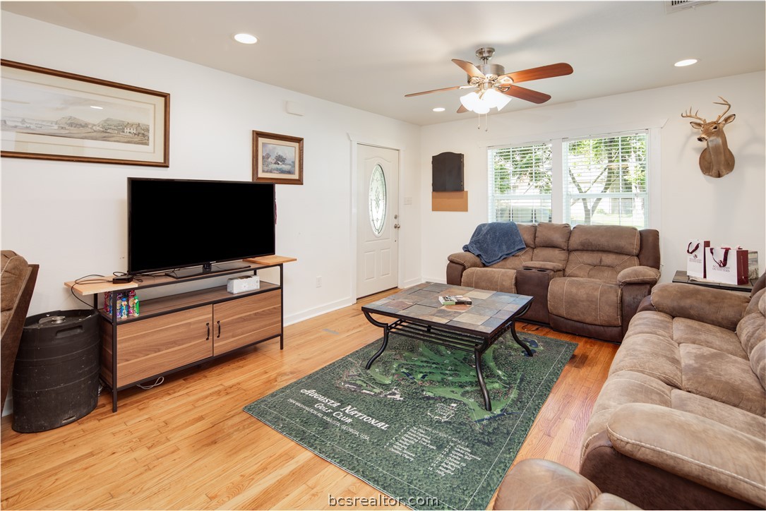 1204 East 28th Street Bryan, TX 77803 - Photo 6 of 22 a living room with furniture and a flat screen tv