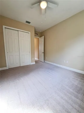 a view of an empty room and a window