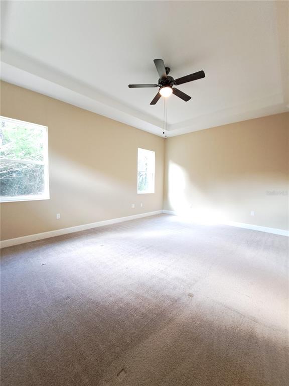 6 Parkview Circle Palm Coast, FL 32137 - Photo 22 of 32 a view of a livingroom with a ceiling fan and window
