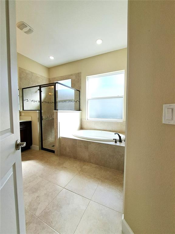 6 Parkview Circle Palm Coast, FL 32137 - Photo 23 of 32 a bathroom with a tub shower and sink