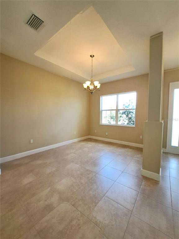 6 Parkview Circle Palm Coast, FL 32137 - Photo 6 of 32 an empty room with windows and ceiling fan