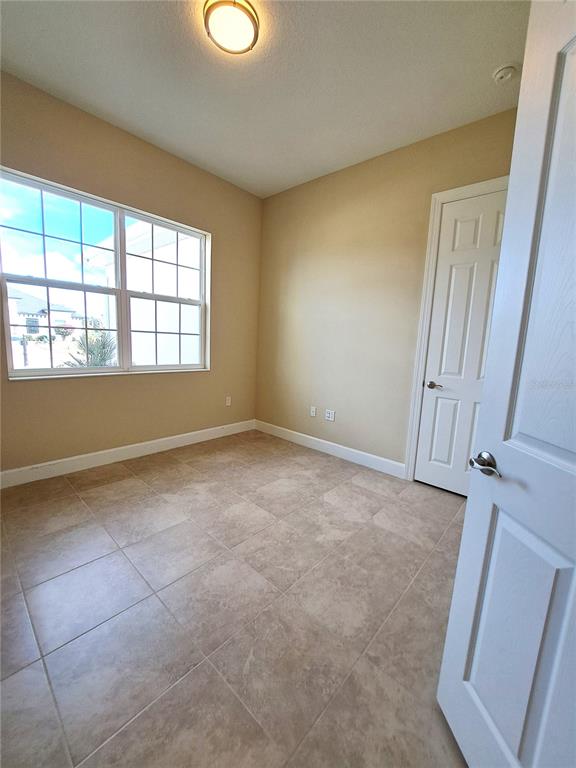 6 Parkview Circle Palm Coast, FL 32137 - Photo 8 of 32 an empty room with windows