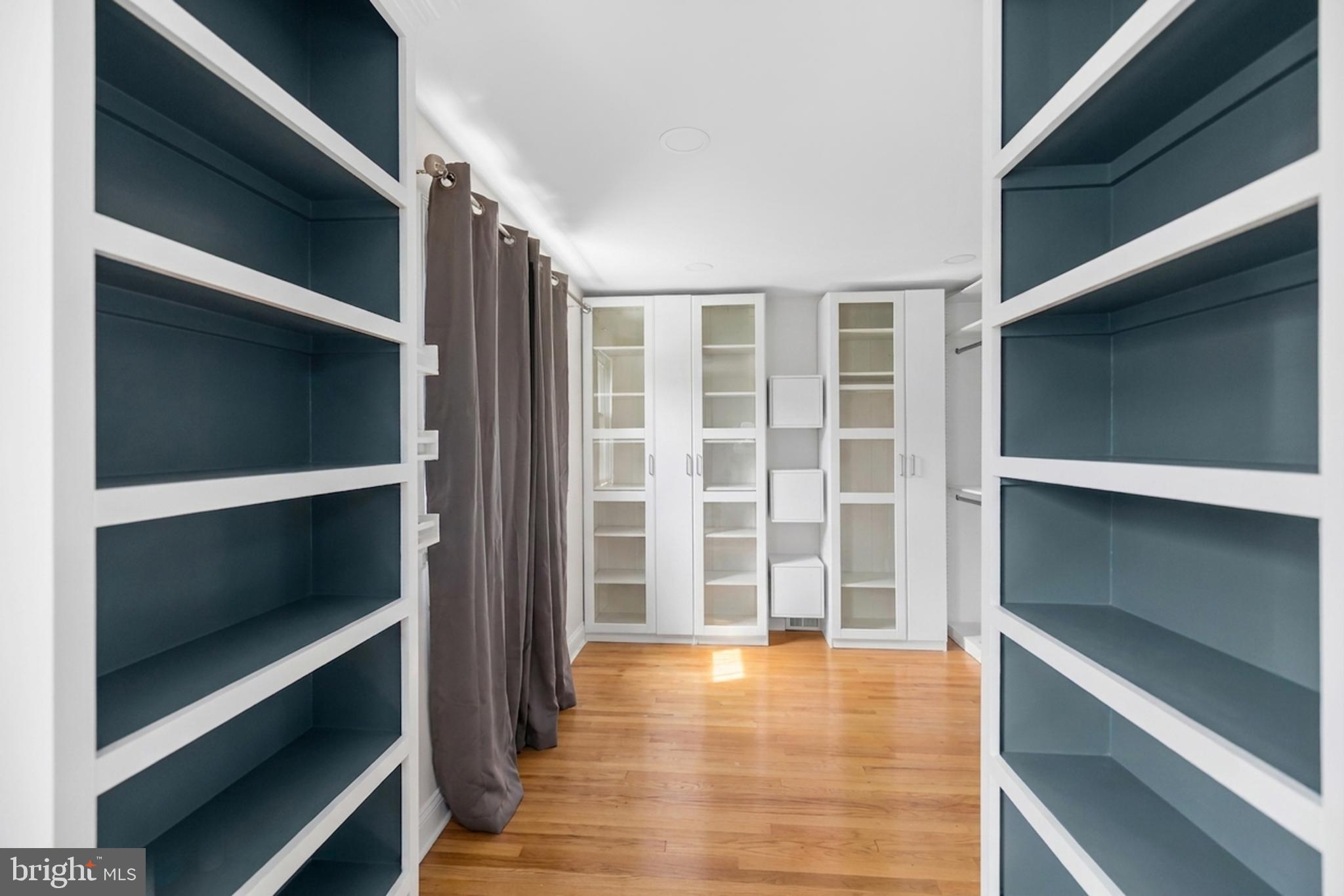 7402 Dunston Street Springfield, VA 22151 - Photo 26 of 37 a view of an empty room with wooden floor and a window