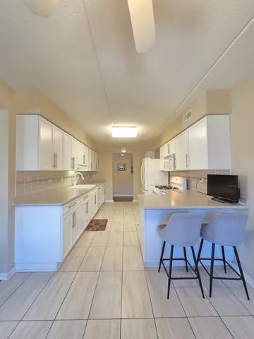 a large kitchen with cabinets