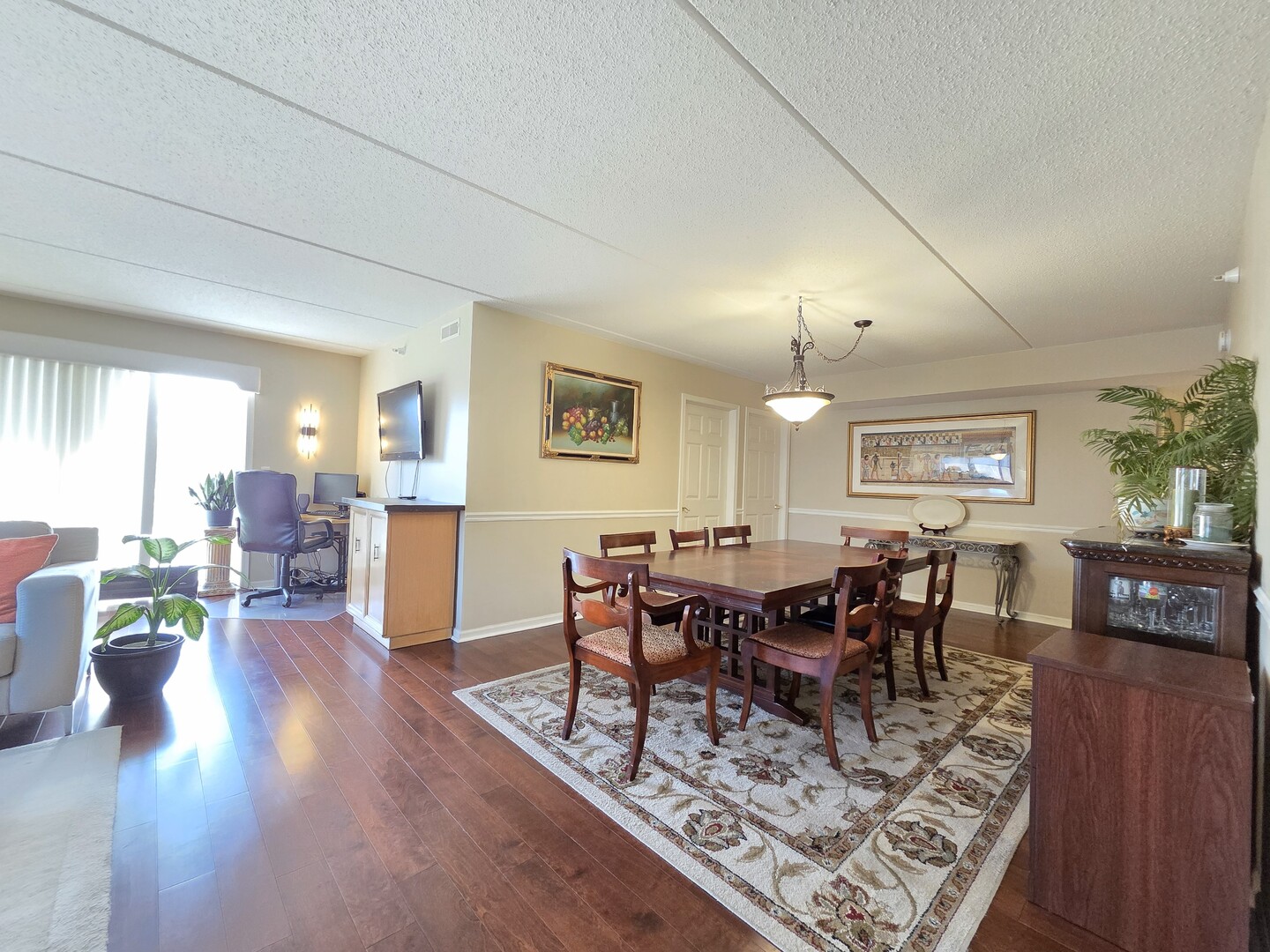 6815 North Milwaukee Avenue, Unit 210 Niles, IL 60714 - Photo 22 of 47 a view of a dining room with furniture window and wooden floor