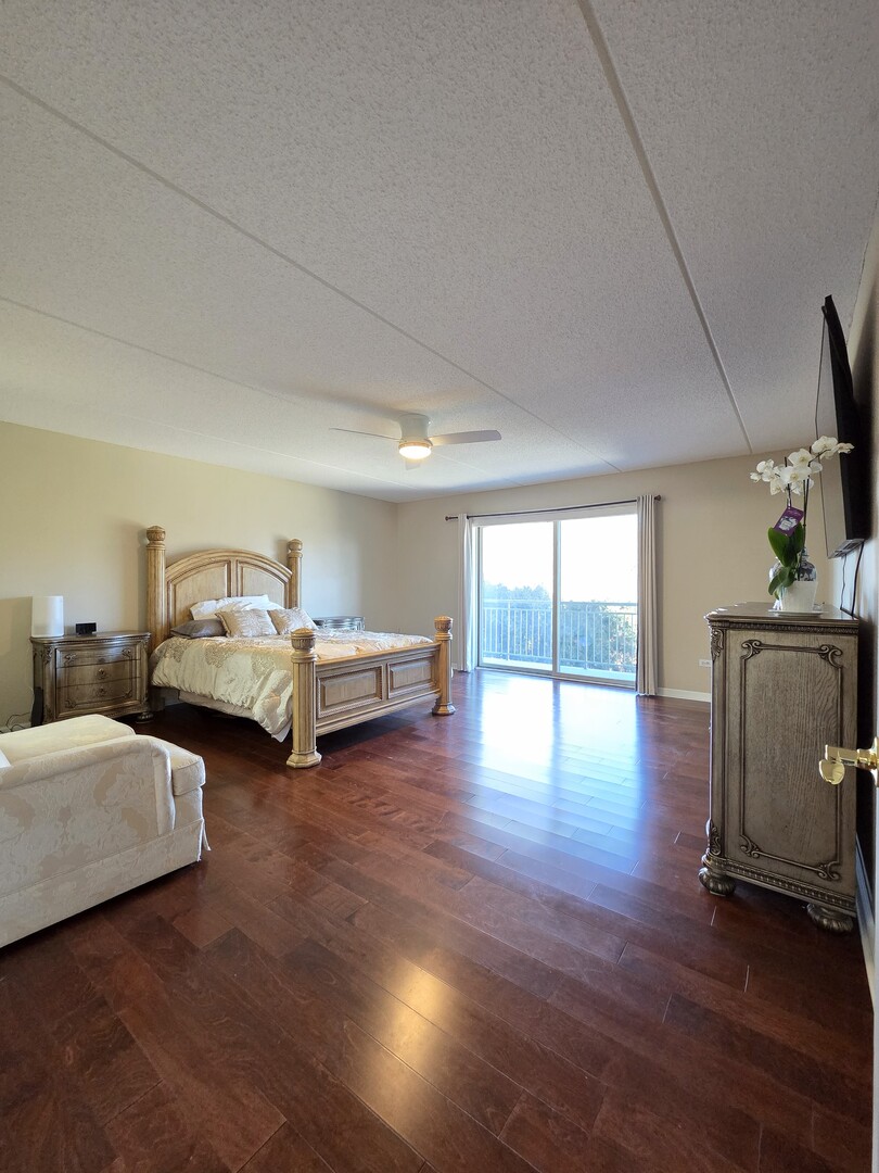 6815 North Milwaukee Avenue, Unit 210 Niles, IL 60714 - Photo 27 of 47 a living room with furniture and a floor to ceiling window