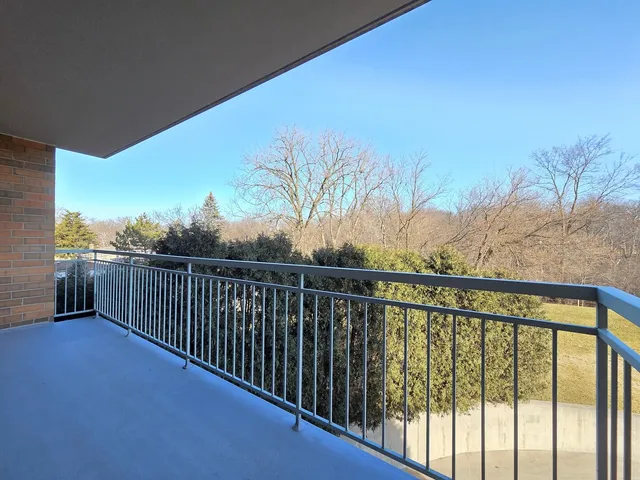 a view of balcony with furniture