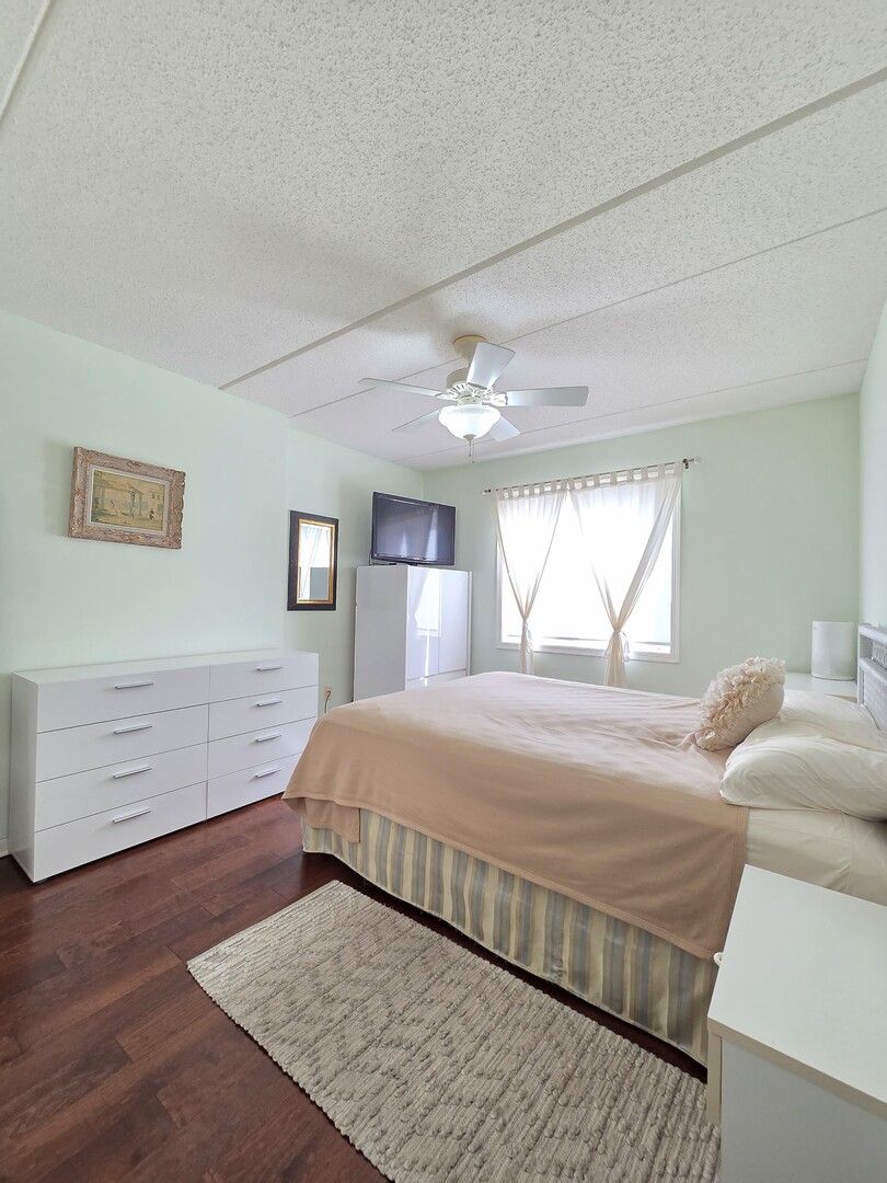 6815 North Milwaukee Avenue, Unit 210 Niles, IL 60714 - Photo 39 of 47 a bedroom with a bed and window