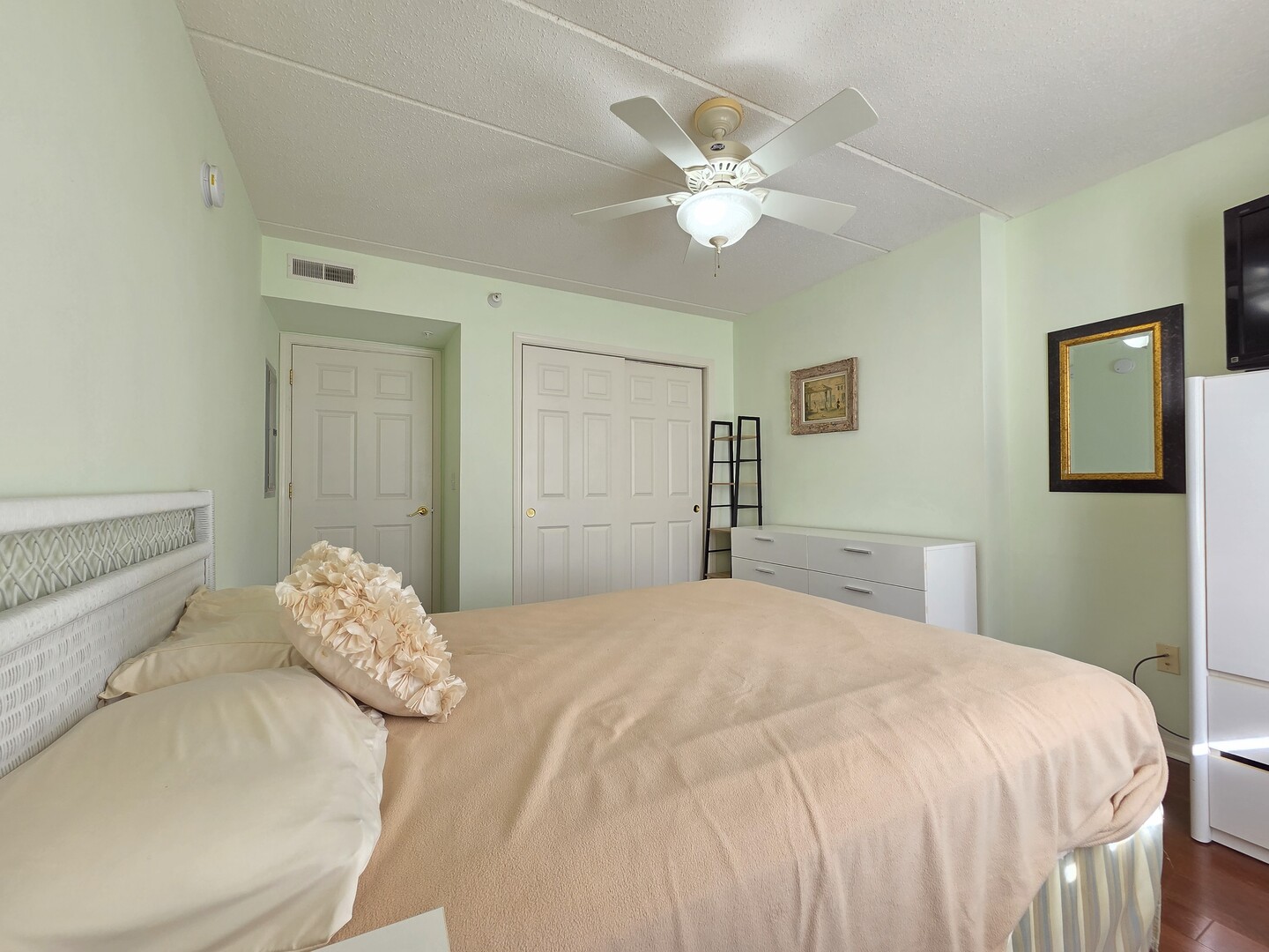 6815 North Milwaukee Avenue, Unit 210 Niles, IL 60714 - Photo 40 of 47 a bedroom with a bed and a chandelier