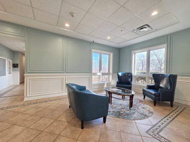 a view of a workspace with furniture