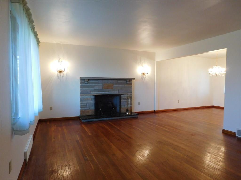 797 Deer Lane Rochester, PA 15074 - Photo 4 of 18 *Spacious Living Room with Cozy Fireplace Featuring Elegant Lighting!* *Light and Bright Rooms!*