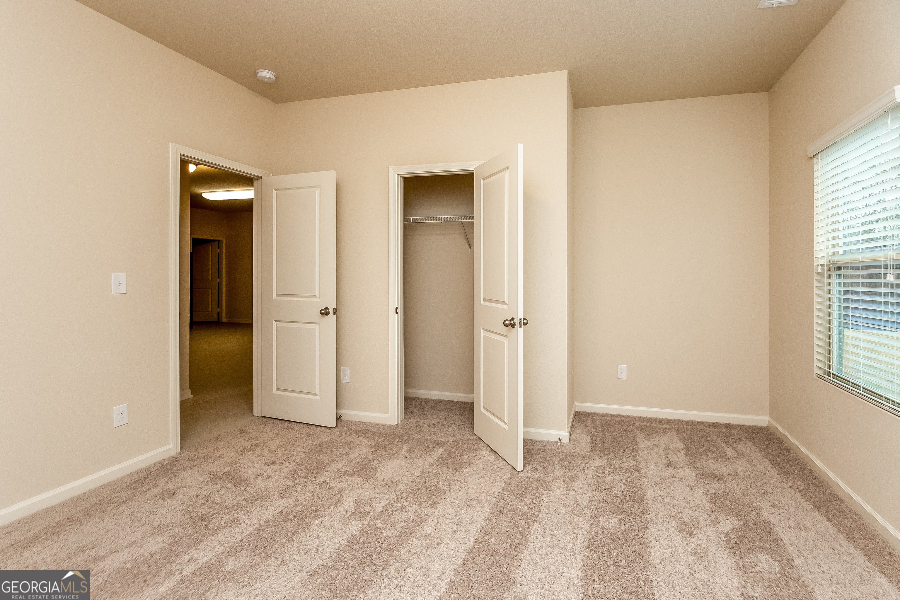 30 Olivia Way Covington, GA 30016 - Photo 11 of 15 an empty room with a window and a bathroom