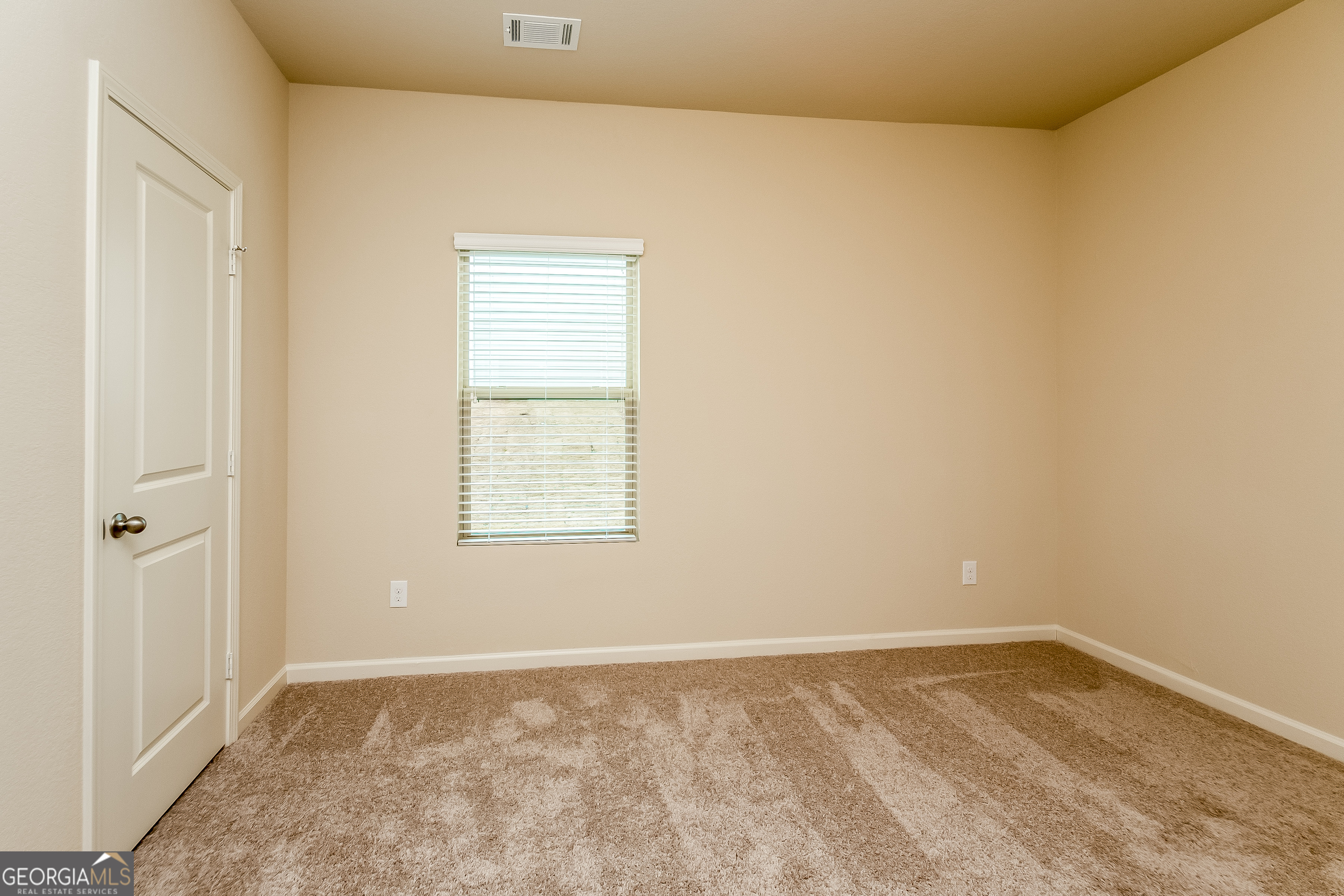 30 Olivia Way Covington, GA 30016 - Photo 12 of 15 a view of an empty room and window