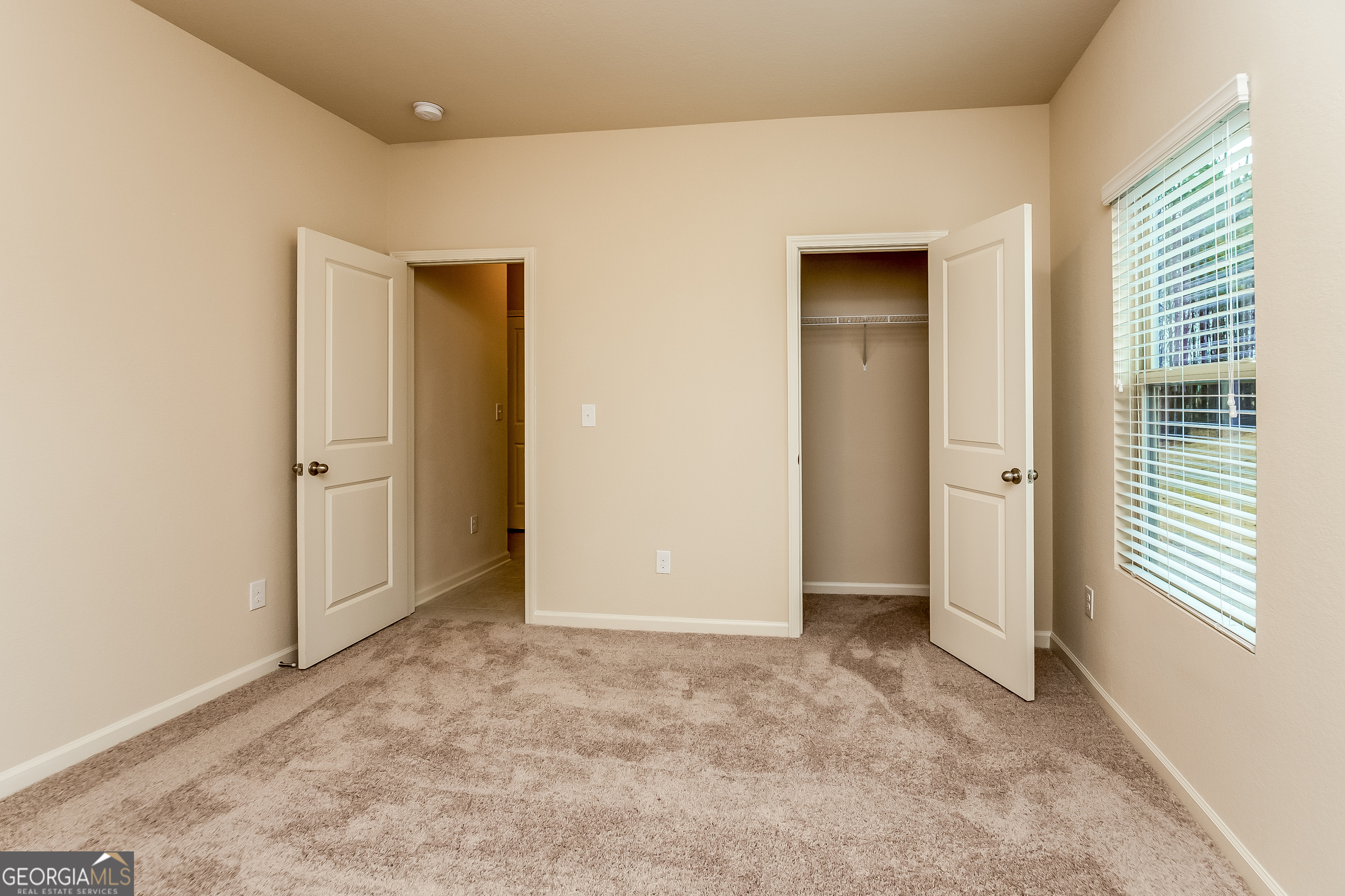 30 Olivia Way Covington, GA 30016 - Photo 13 of 15 an empty room with windows and closet
