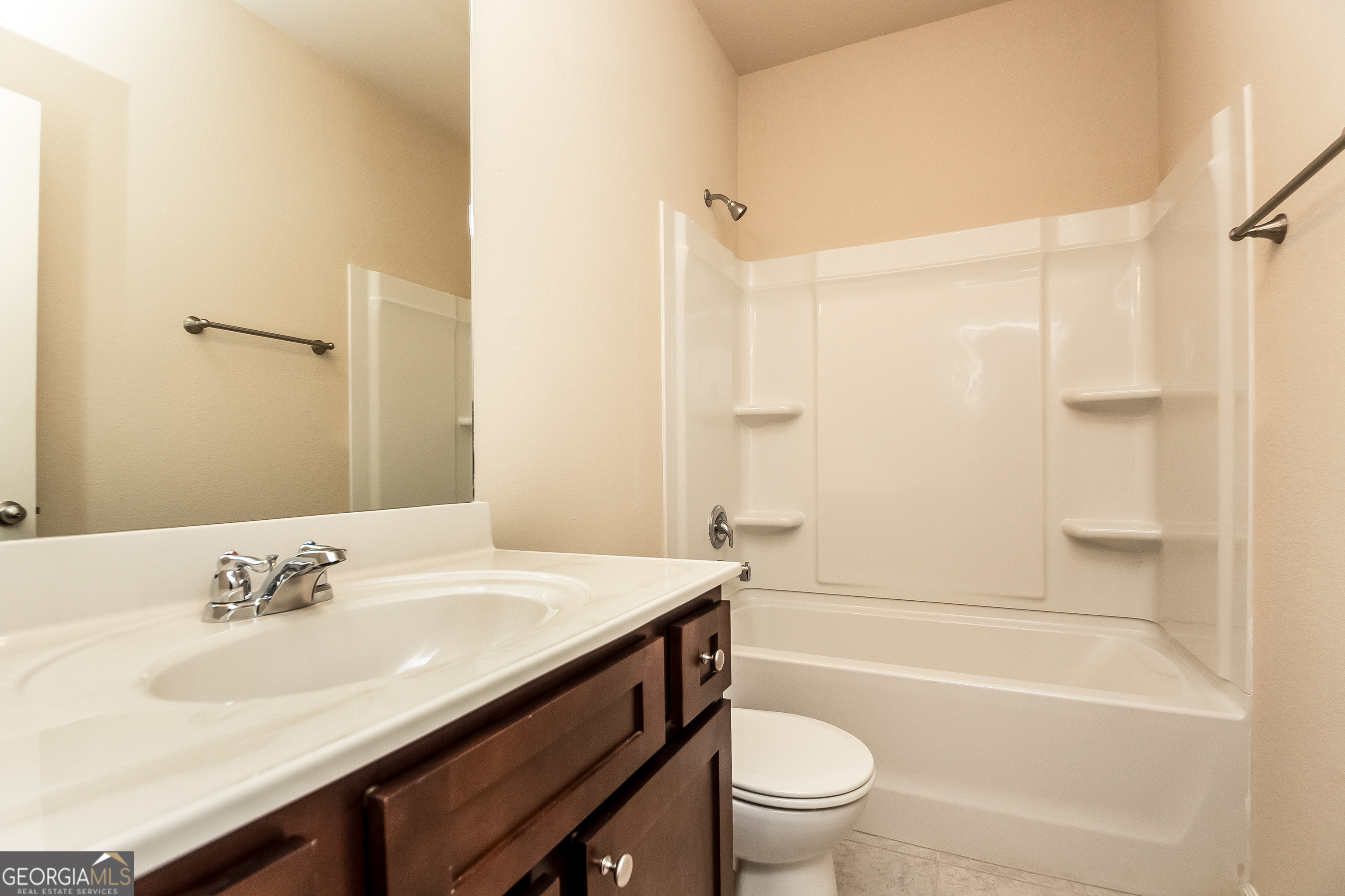 30 Olivia Way Covington, GA 30016 - Photo 14 of 15 a bathroom with a sink a toilet and a mirror