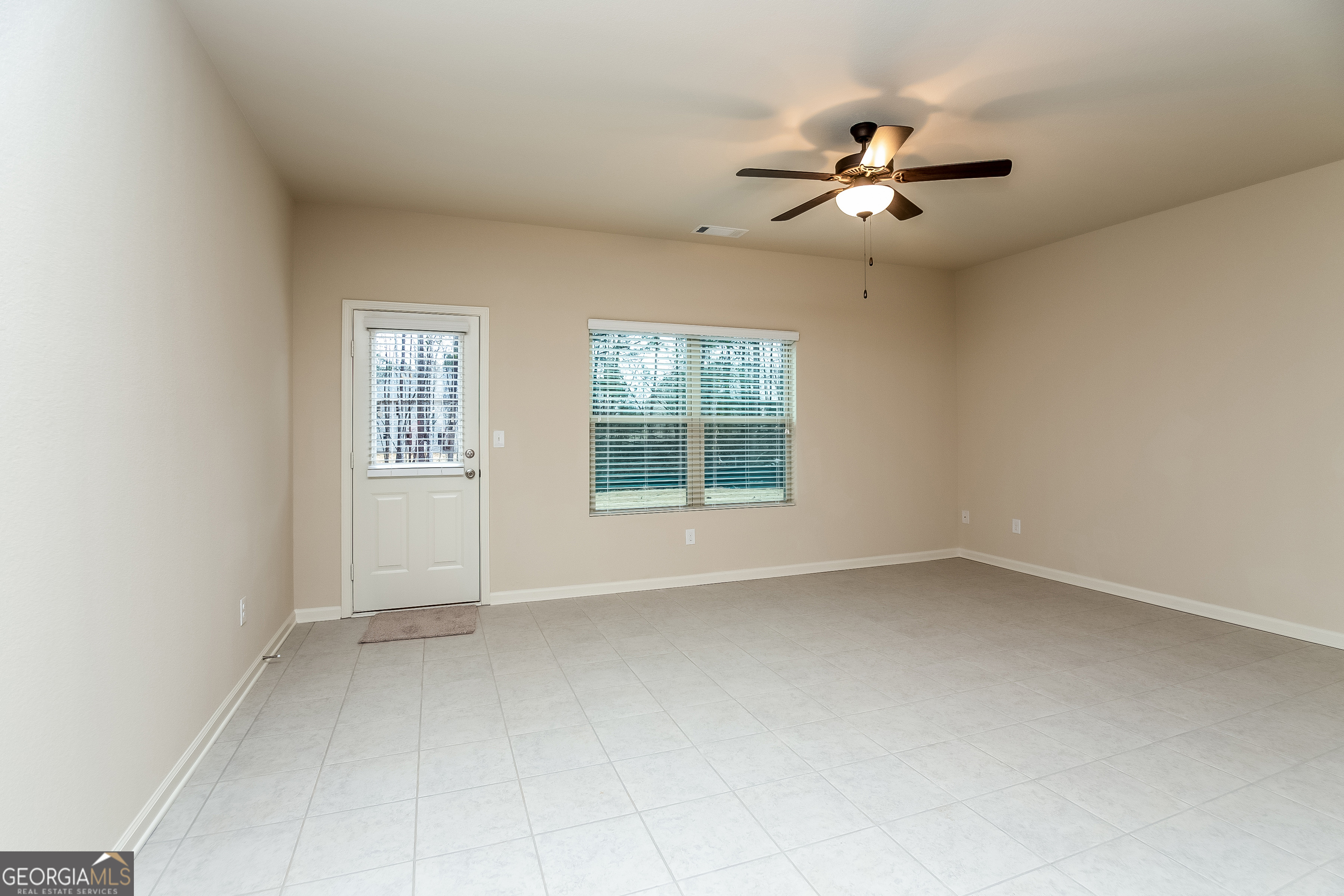 30 Olivia Way Covington, GA 30016 - Photo 3 of 15 a view of an empty room with a window