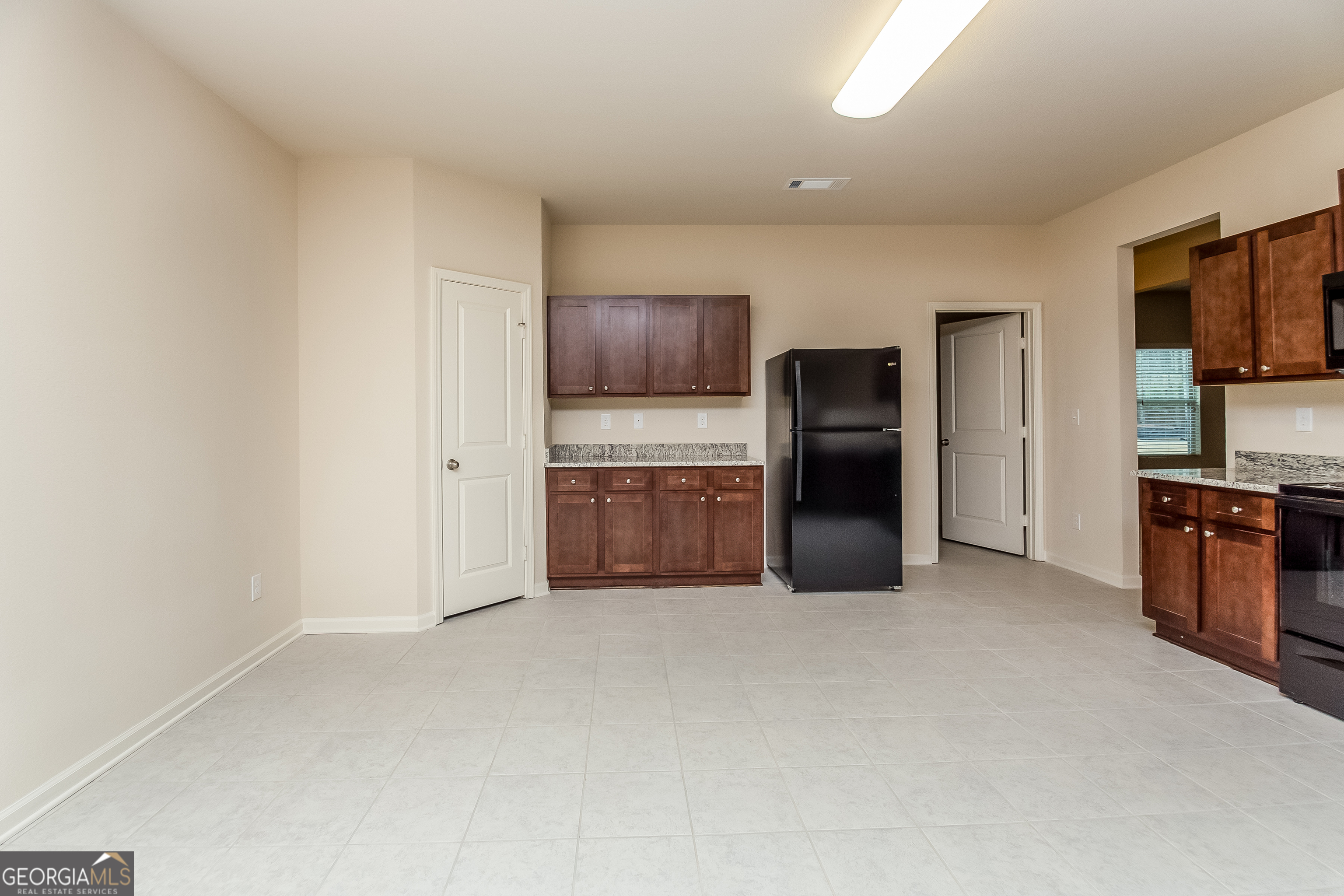 30 Olivia Way Covington, GA 30016 - Photo 4 of 15 a kitchen with stainless steel appliances a refrigerator and a stove top oven