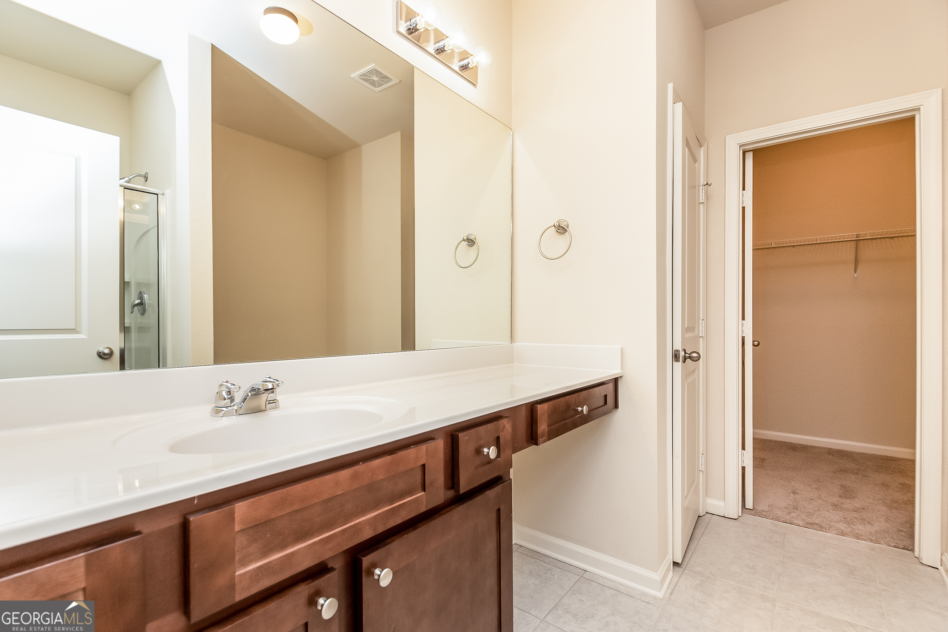 30 Olivia Way Covington, GA 30016 - Photo 8 of 15 a bathroom with a sink and a mirror