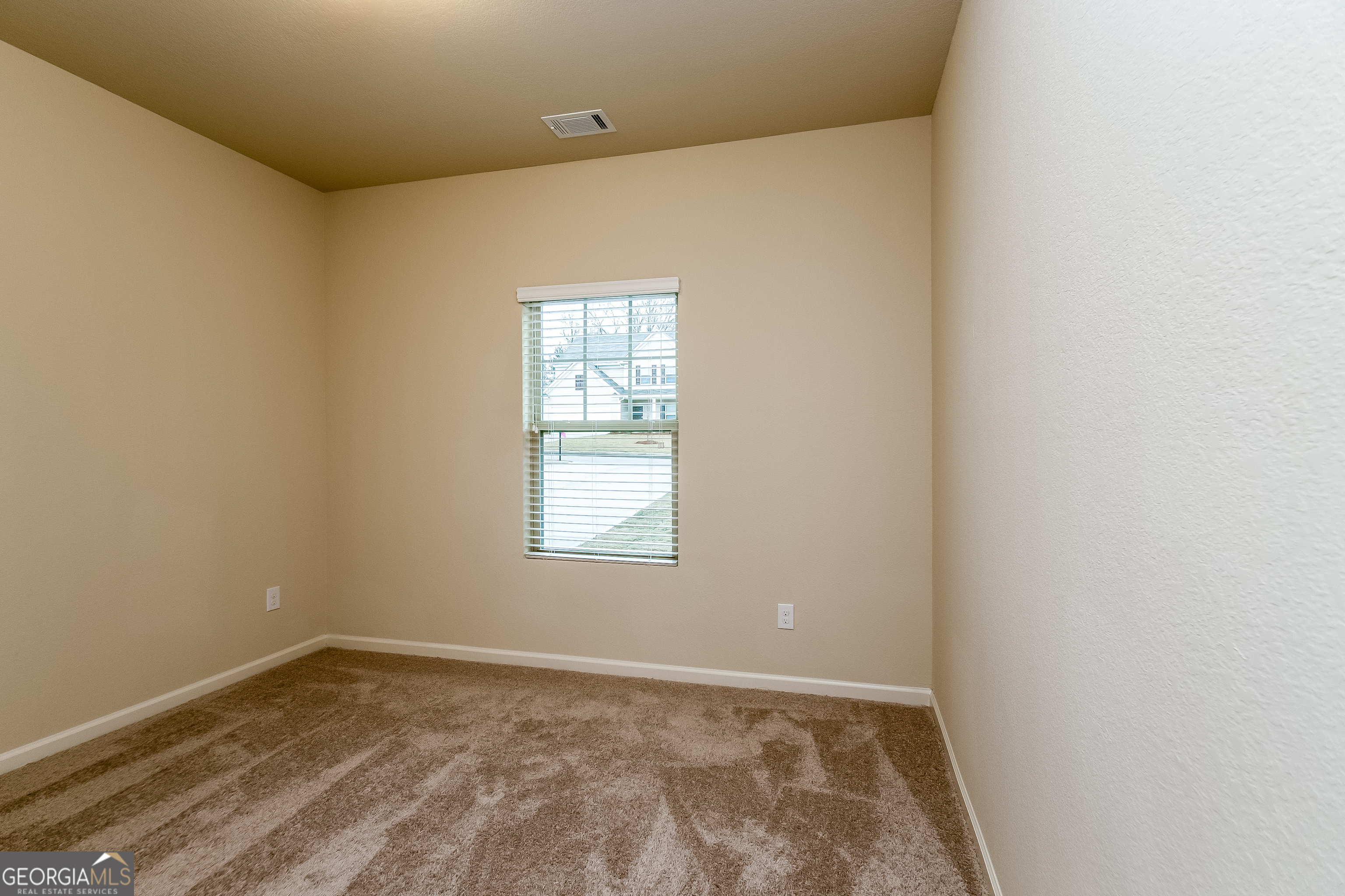30 Olivia Way Covington, GA 30016 - Photo 9 of 15 a view of an empty room and window