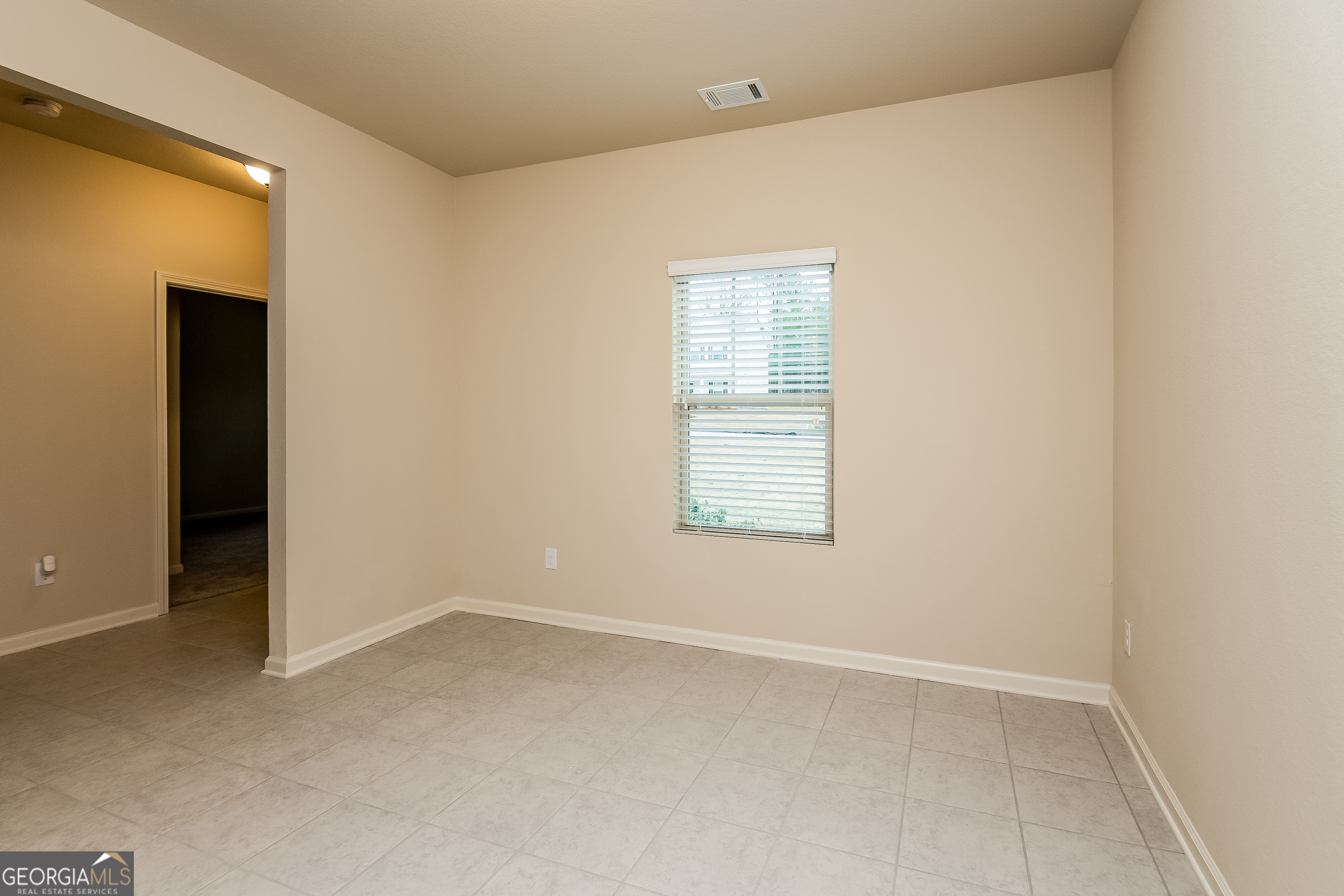 30 Olivia Way Covington, GA 30016 - Photo 10 of 15 an empty room with a window