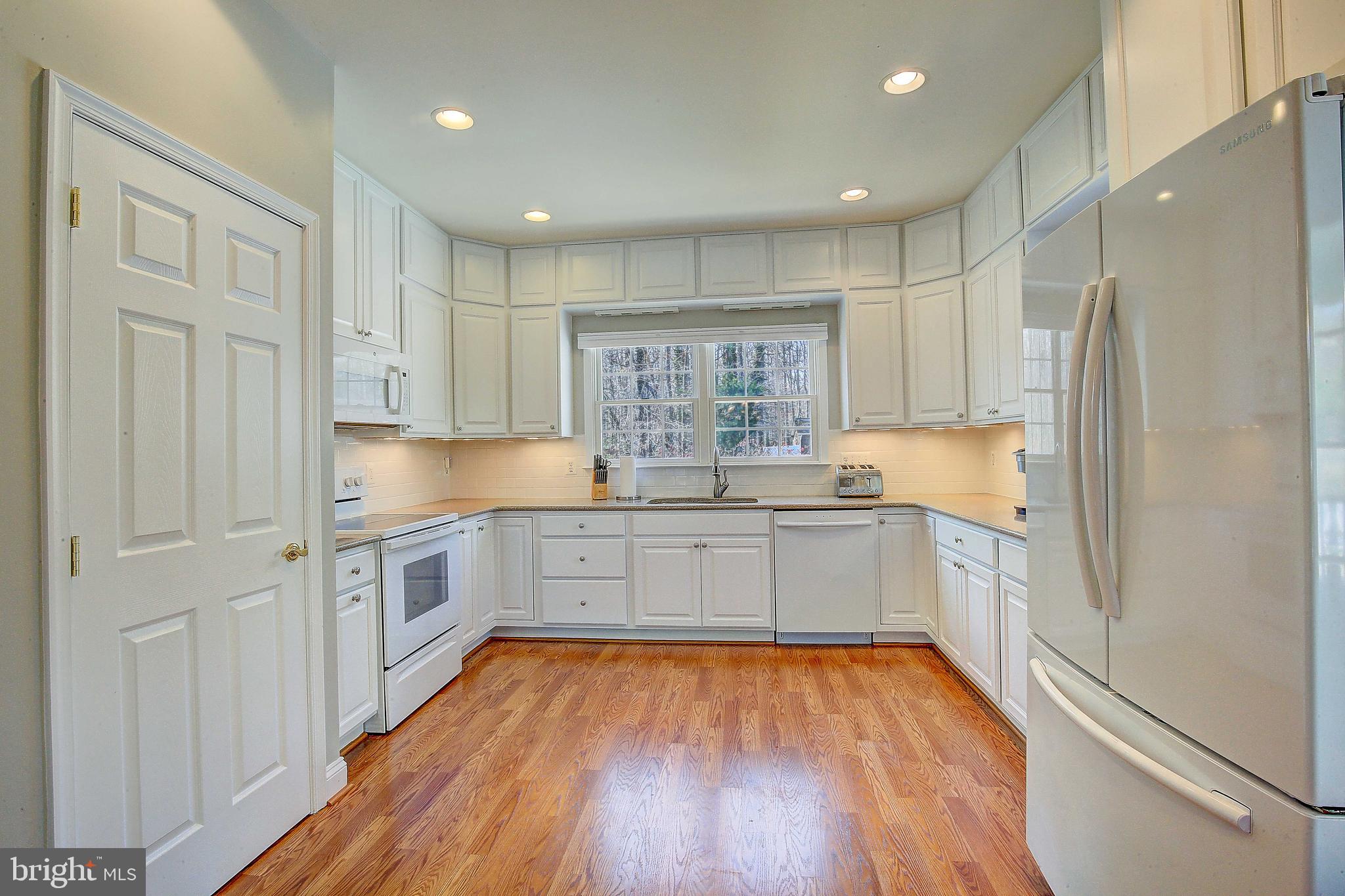 3613 Branhum Road Edgewater, MD 21037 - Photo 19 of 57 Large kitchen space, back splash subway tile