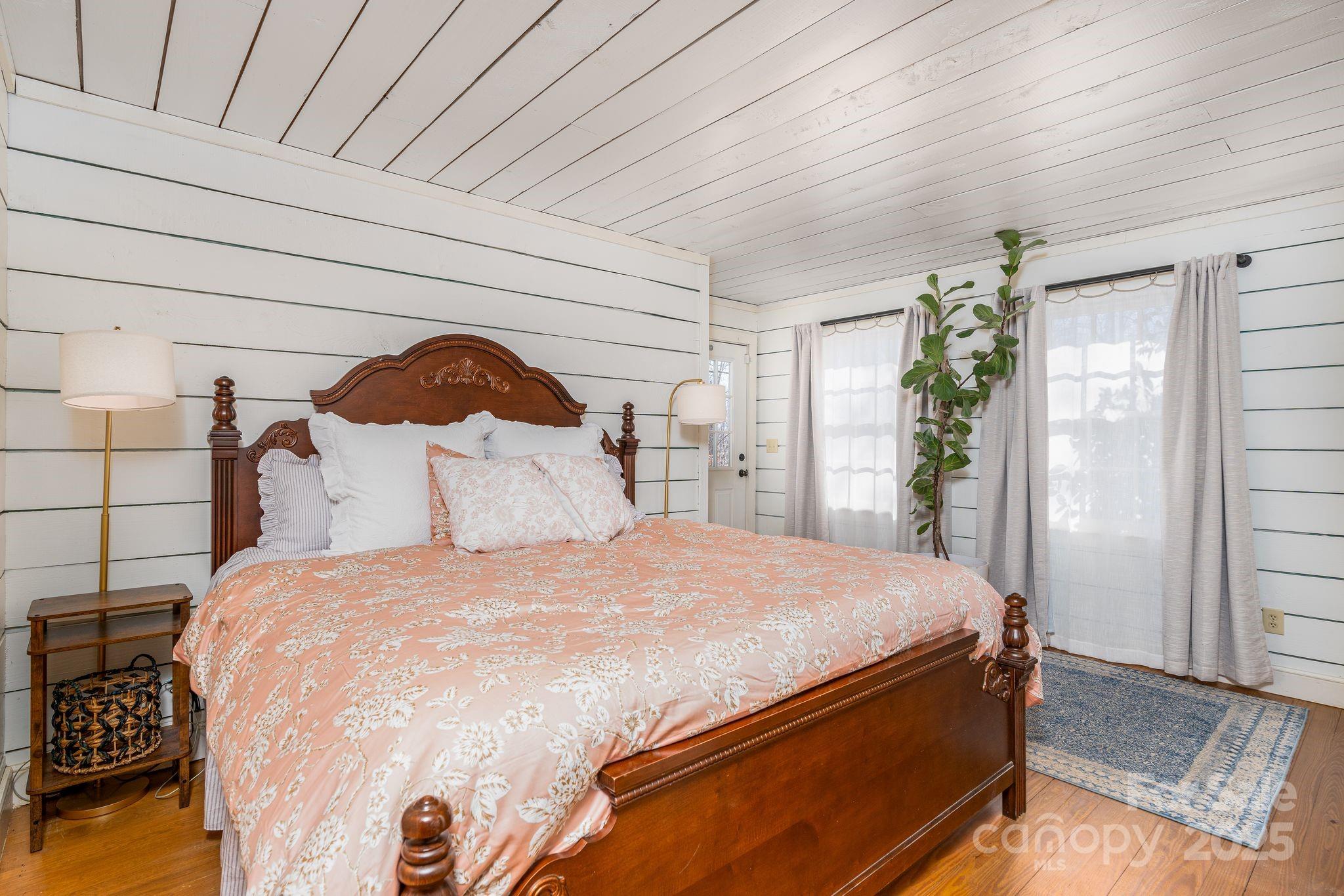 311 North Campbell Road Landrum, SC 29356 - Photo 17 of 48 a bedroom with a bed and a dresser