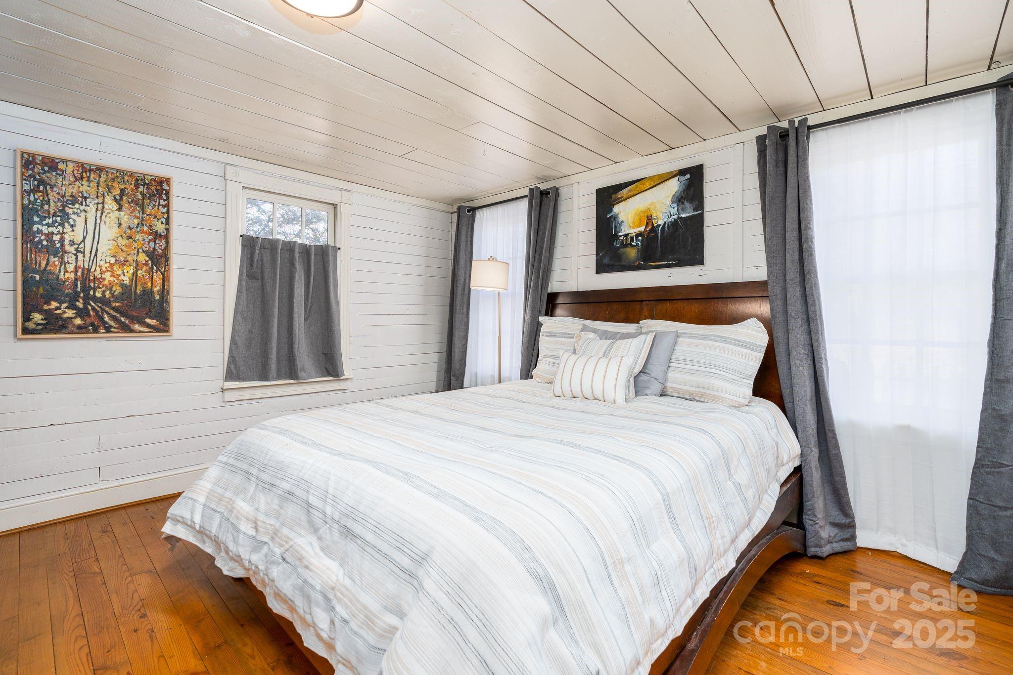 311 North Campbell Road Landrum, SC 29356 - Photo 24 of 48 a bedroom with a bed and a dresser
