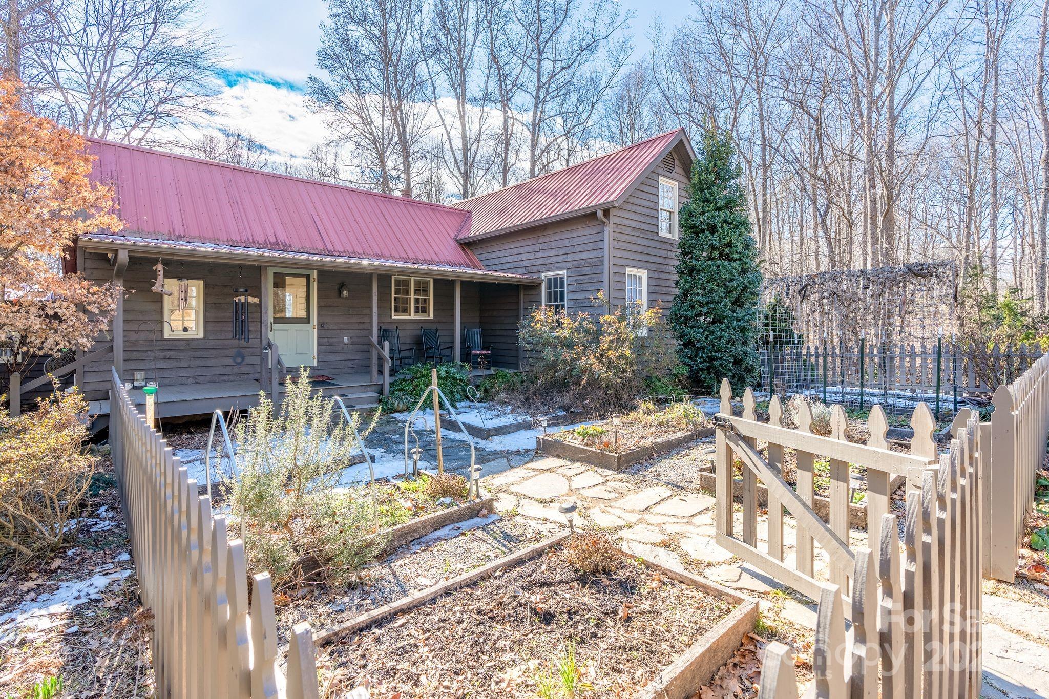 311 North Campbell Road Landrum, SC 29356 - Photo 35 of 48 a view of a house with backyard and sitting area