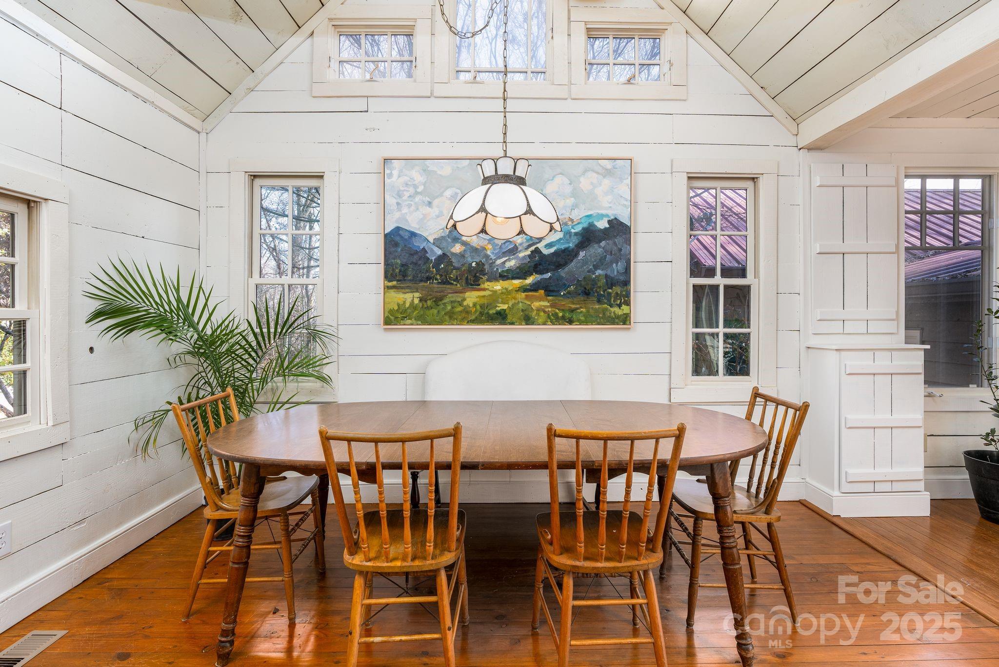 311 North Campbell Road Landrum, SC 29356 - Photo 5 of 48 a view of a dining room with furniture and chandelier