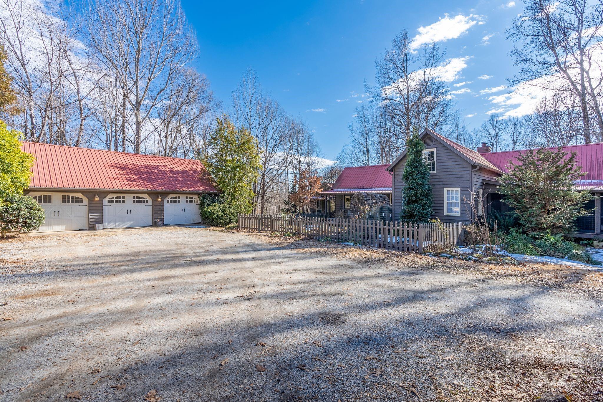 311 North Campbell Road Landrum, SC 29356 - Photo 7 of 48 a front view of a house with a yard and tree