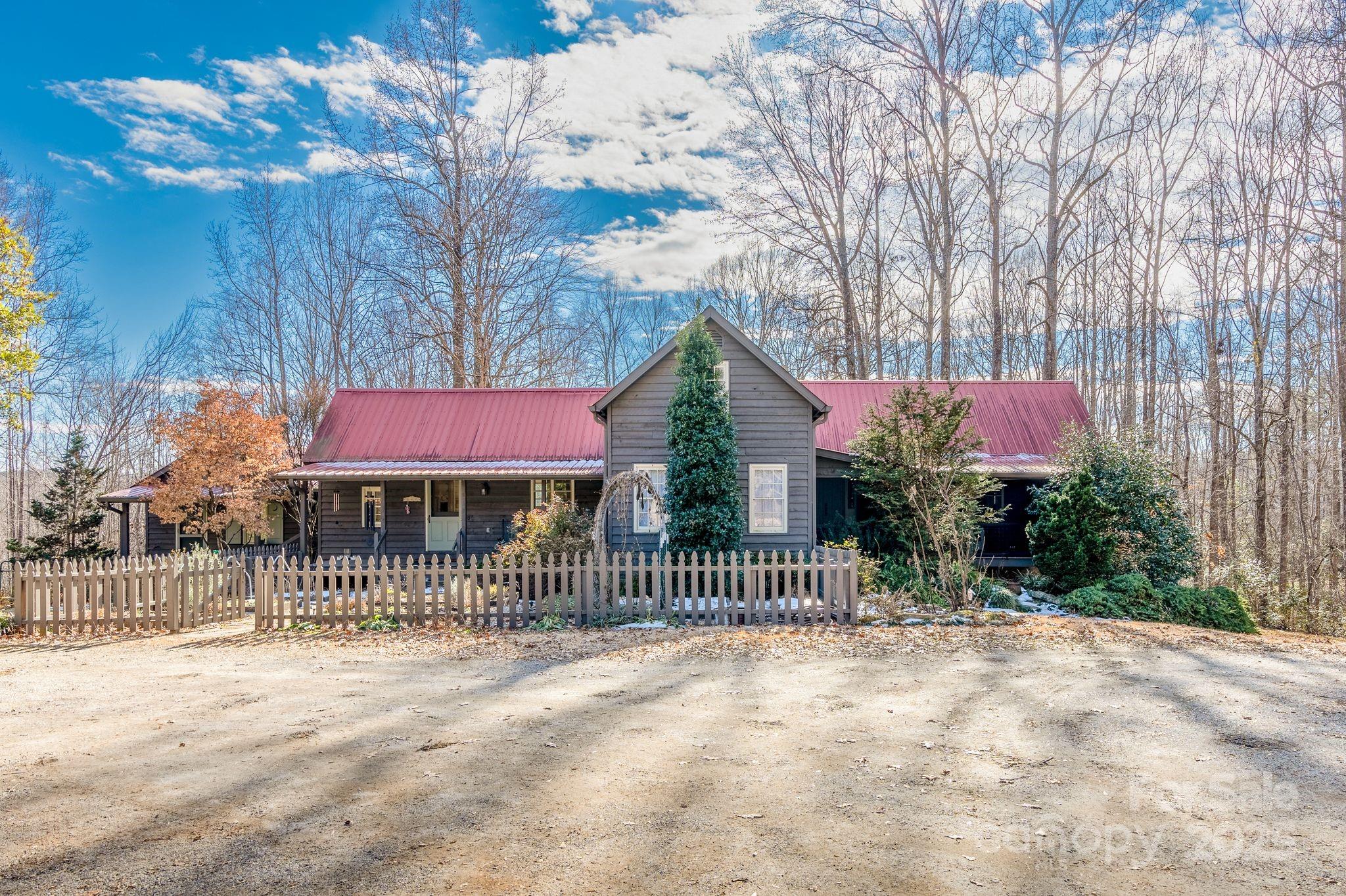 311 North Campbell Road Landrum, SC 29356 - Photo 10 of 48 a front view of a house with a fence