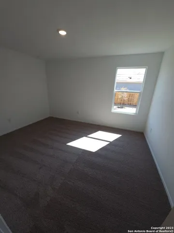 an empty room with a empty space and window