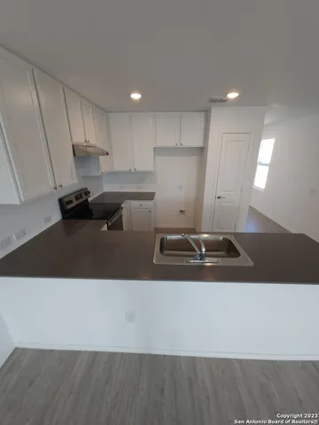 a view of wooden floor and seating space