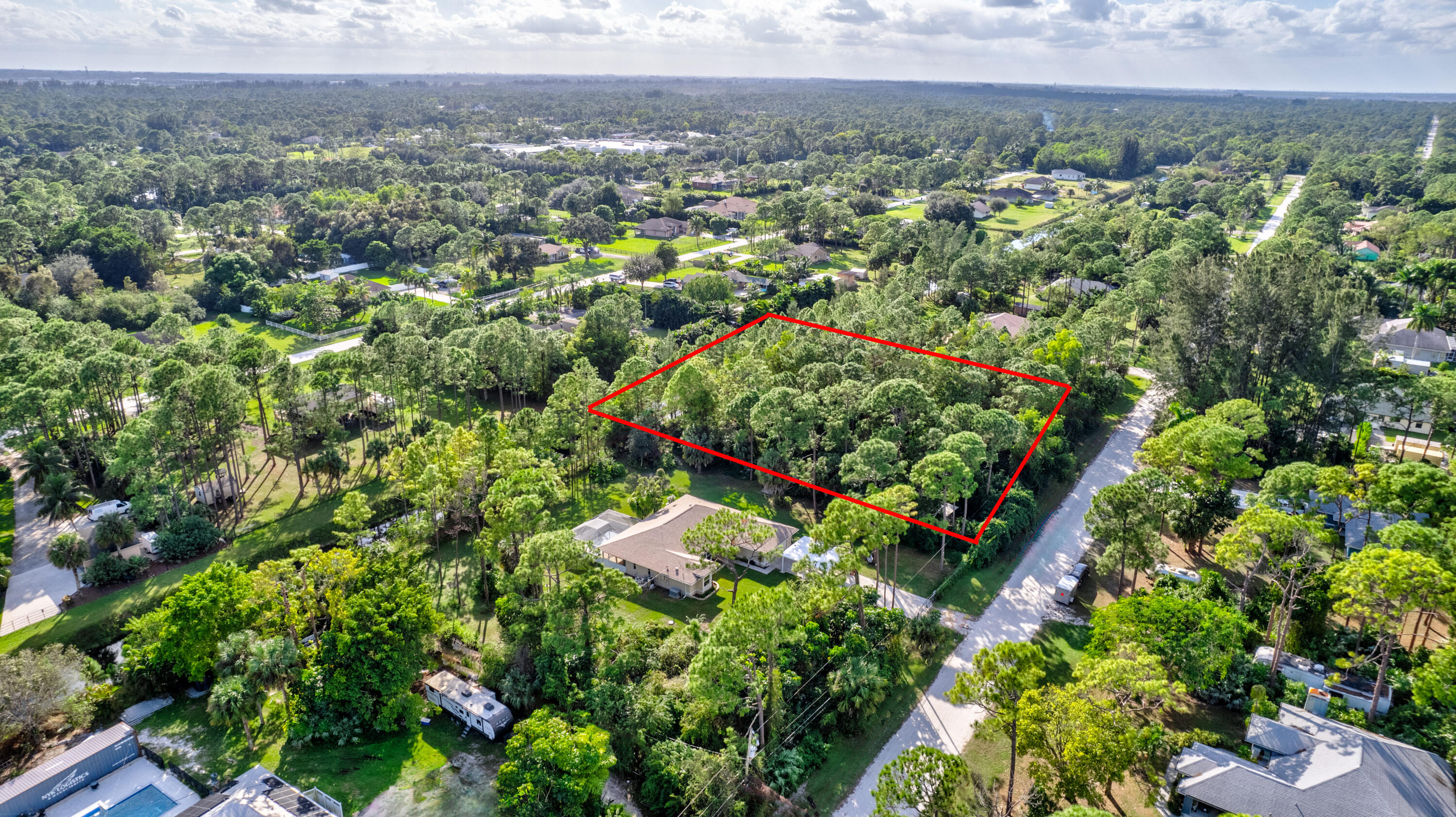 0 73rd Street North Loxahatchee, FL 33470 - Photo 4 of 5 a view of a city with lush green forest