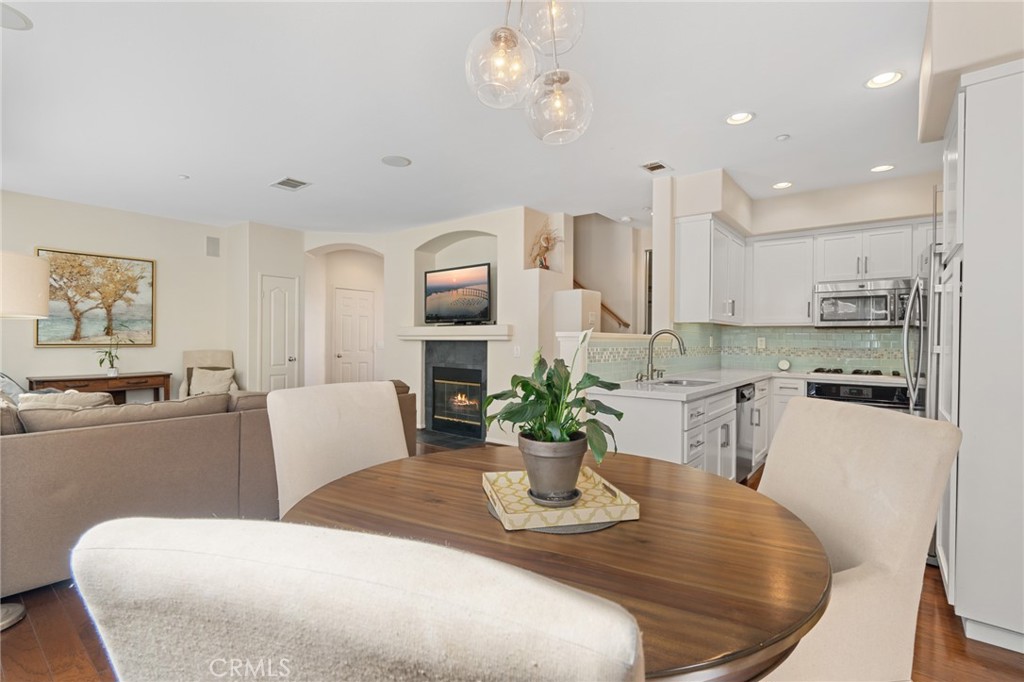 3073 Via Maximo Carlsbad, CA 92009 - Photo 10 of 21 Dining area facing living room and kitchen