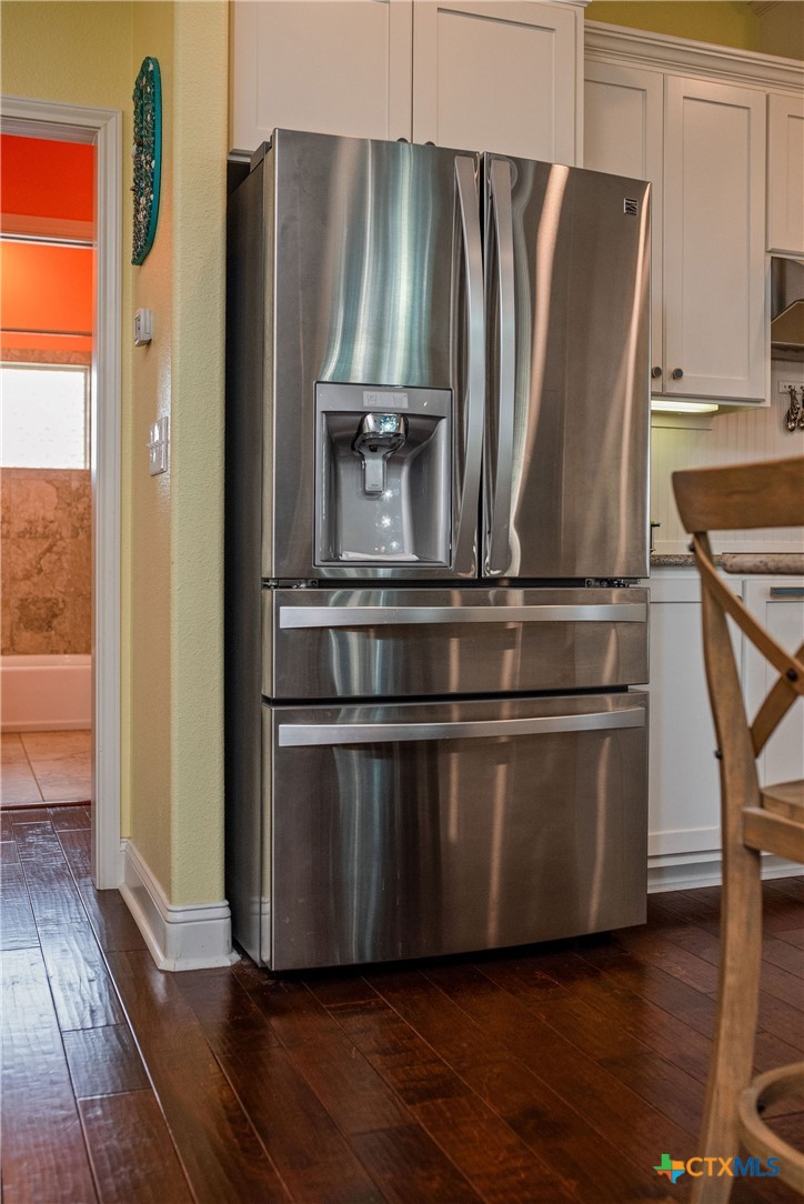 23 Macey Street Port O'Connor, TX 77982 - Photo 44 of 47 a metallic refrigerator freezer sitting in a kitchen