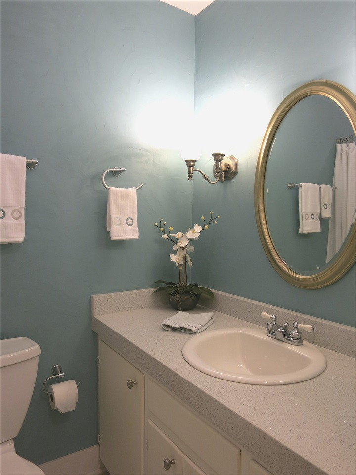 4716 Hiddenbrook Drive Raleigh, NC 27609 - Photo 19 of 25 The hall Bath features a quartz vanity top, marble tile floor & tiled tub/shower. Bathroom