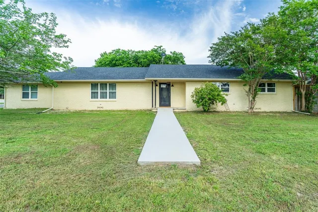 front view of house with a yard
