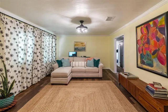 a spacious bedroom with a bed and a couch