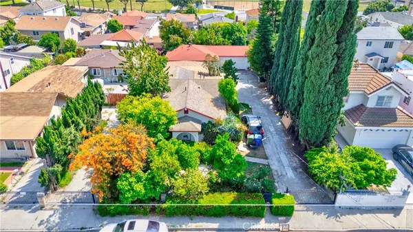 an aerial view of a house with a garden