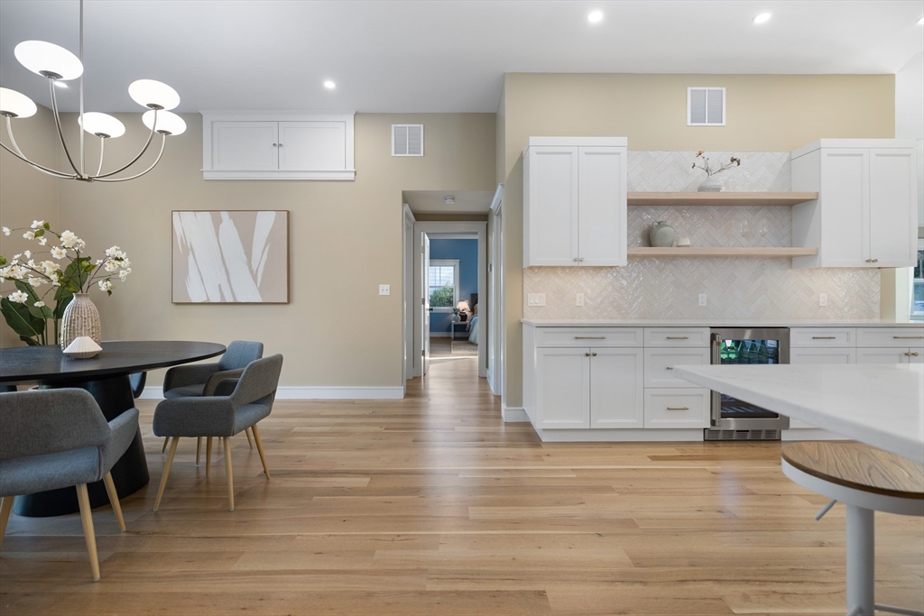 2 Howard Court Woburn, MA 01801 - Photo 11 of 37 a kitchen with cabinets table and chairs