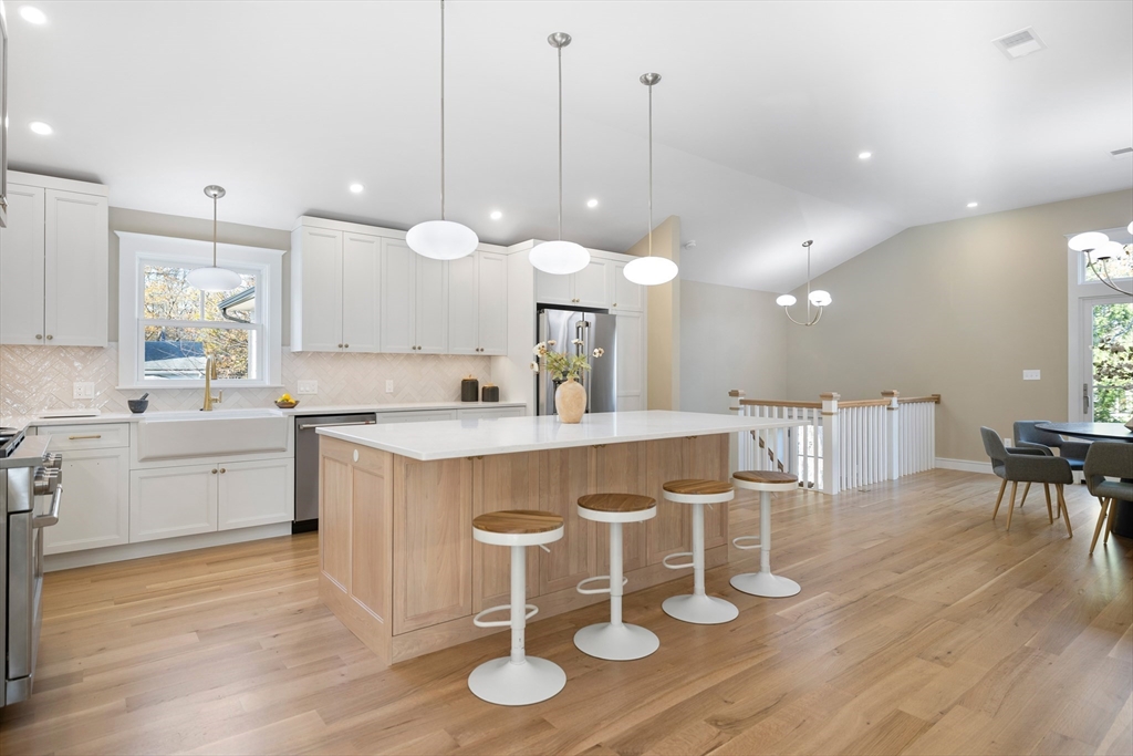 2 Howard Court Woburn, MA 01801 - Photo 13 of 37 a large kitchen with a table and chairs