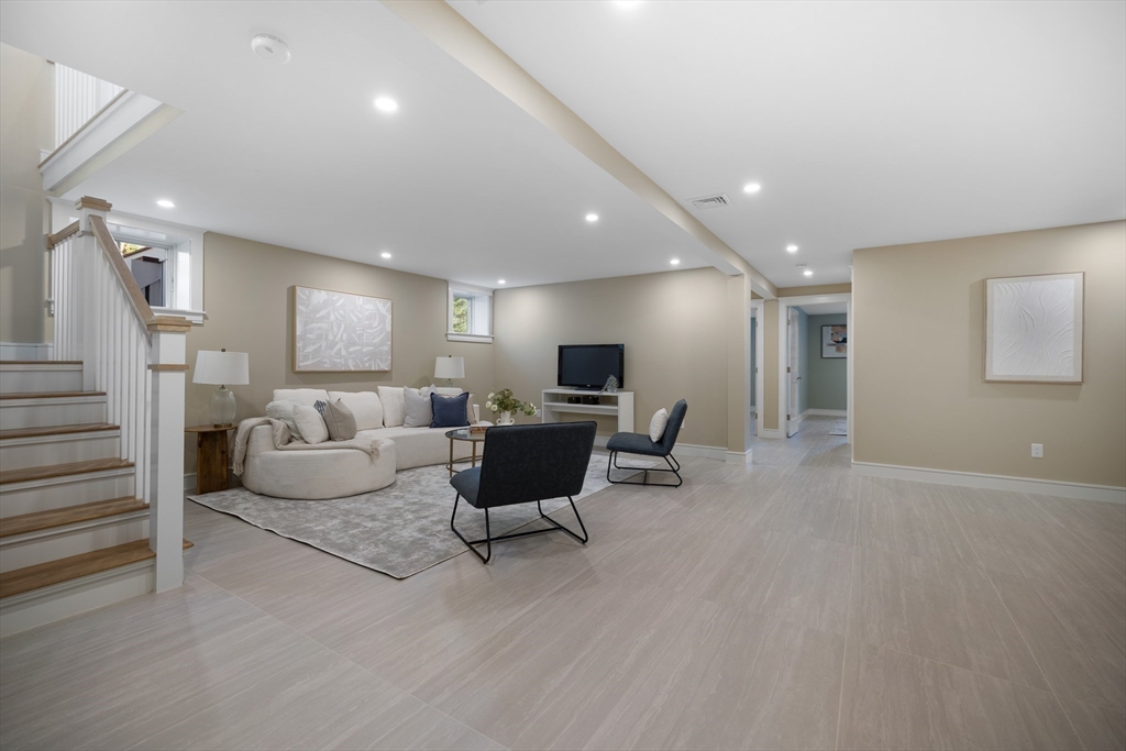 2 Howard Court Woburn, MA 01801 - Photo 24 of 37 a living room with furniture and a table