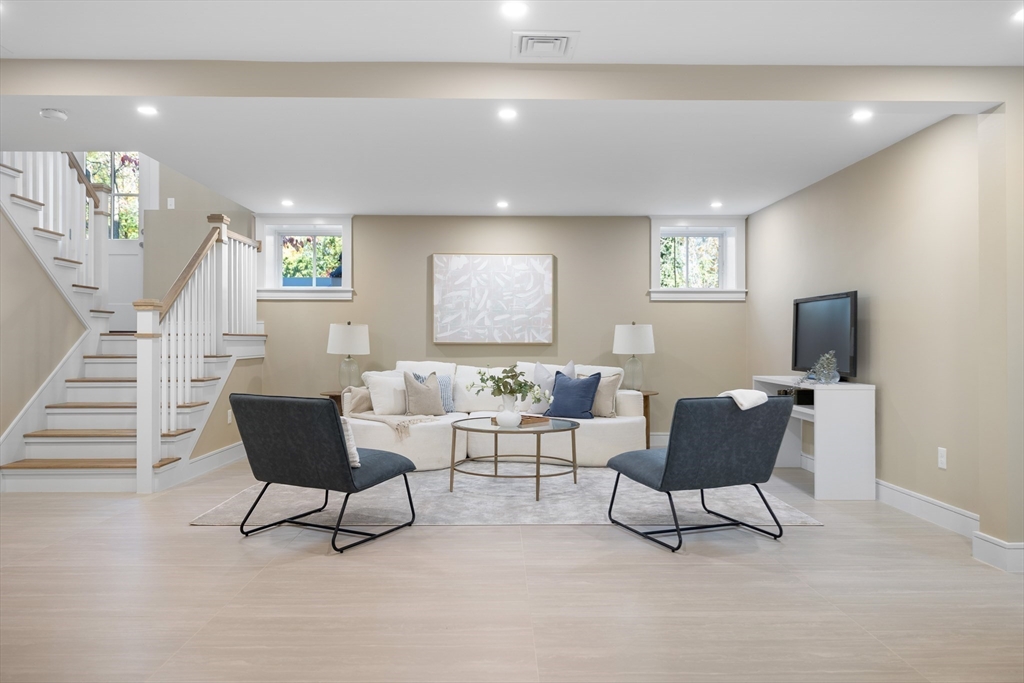 2 Howard Court Woburn, MA 01801 - Photo 25 of 37 a living room with furniture and a potted plant