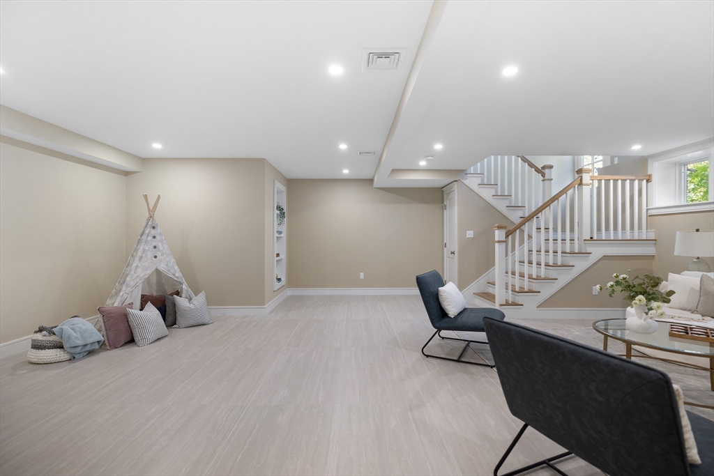 2 Howard Court Woburn, MA 01801 - Photo 27 of 37 a room with gym equipment and wooden floor