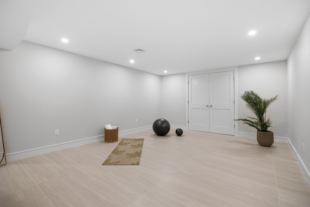 2 Howard Court Woburn, MA 01801 - Photo 28 of 37 a room with a potted plant